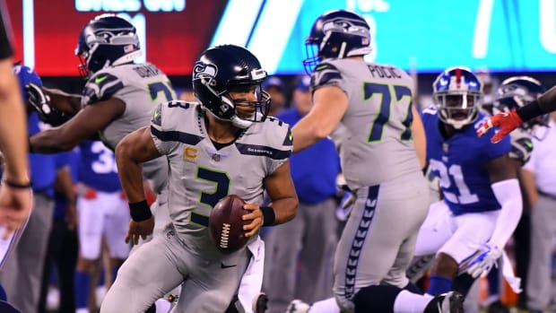 Oct 22, 2017; East Rutherford, NJ, USA; Seattle Seahawks quarterback Russell Wilson (3) scrambles in the second half against the New York Giants at MetLife Stadium.